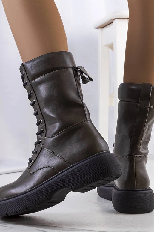 Beige insulated boots with chain...