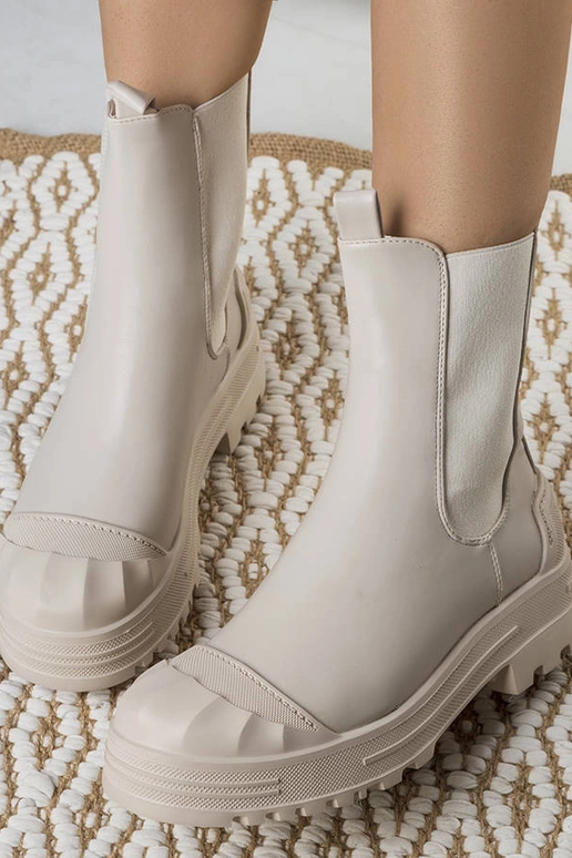 Beige insulated boots with chain...