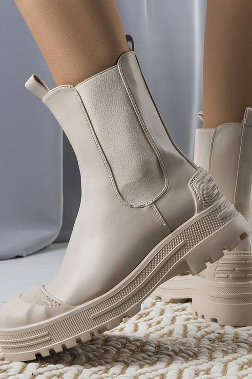 Beige insulated boots with chain...