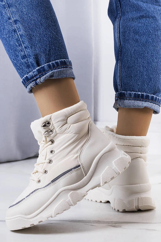 Beige insulated boots with chain...