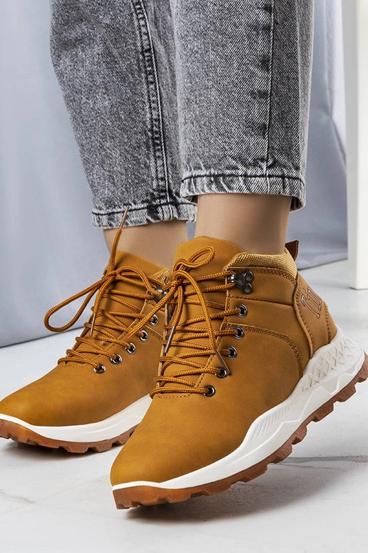 Beige insulated boots with chain...