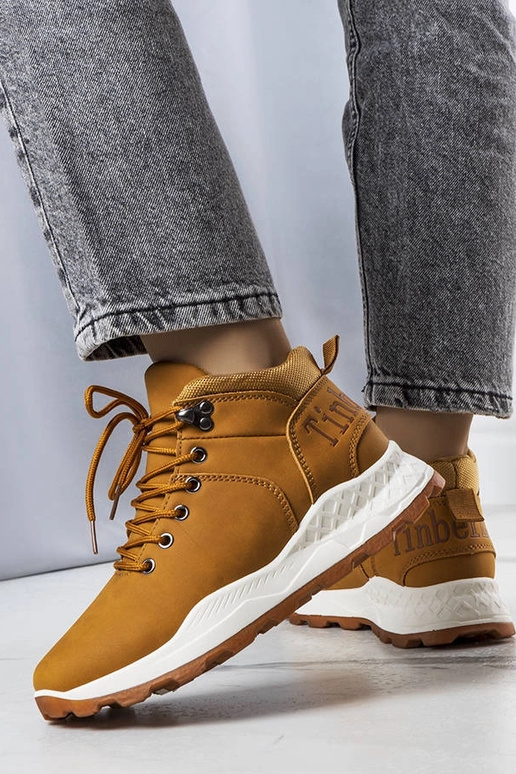 Beige insulated boots with chain...