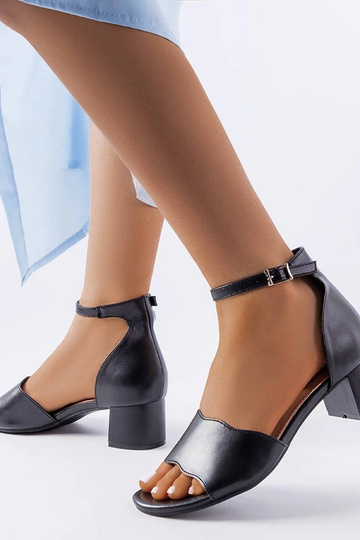 Black sandals on a block... 2