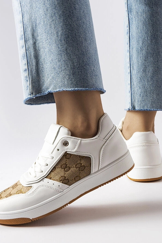 Białe sneakersy zdobione monogramem...