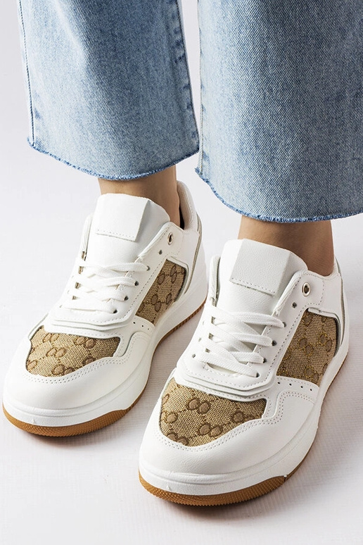 Białe sneakersy zdobione monogramem...