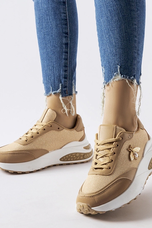 Brązowo-białe sneakersy z ozdobna...