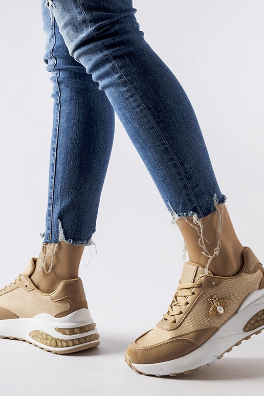 Brązowo-białe sneakersy z ozdobna...