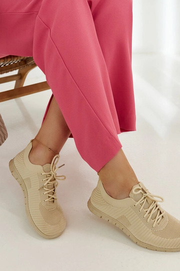 Pink sports sneakers by... 2