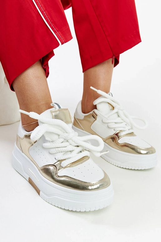 Biało-złote sneakersy na wysokiej...