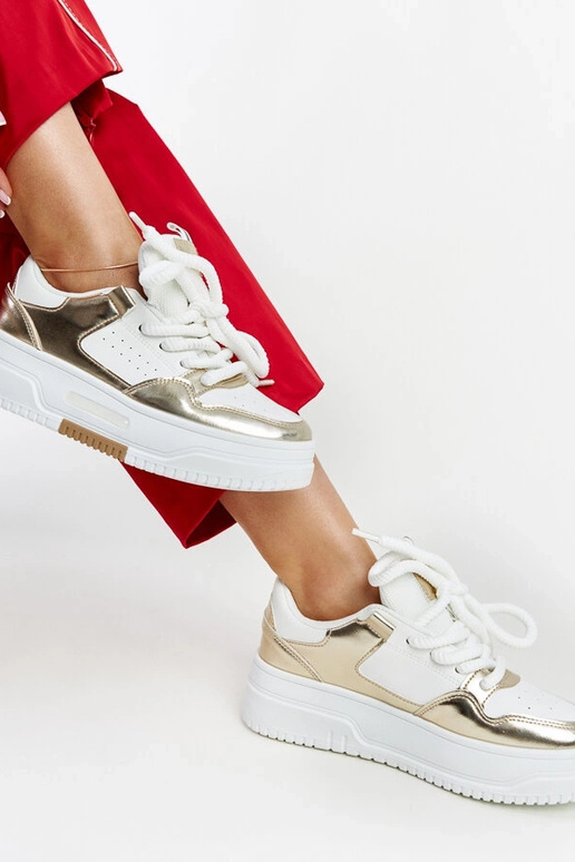 Biało-złote sneakersy na wysokiej...
