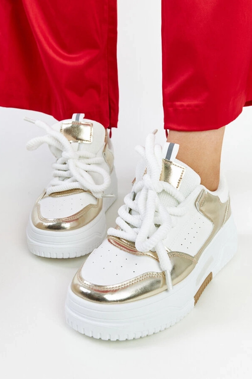 Biało-złote sneakersy na wysokiej...