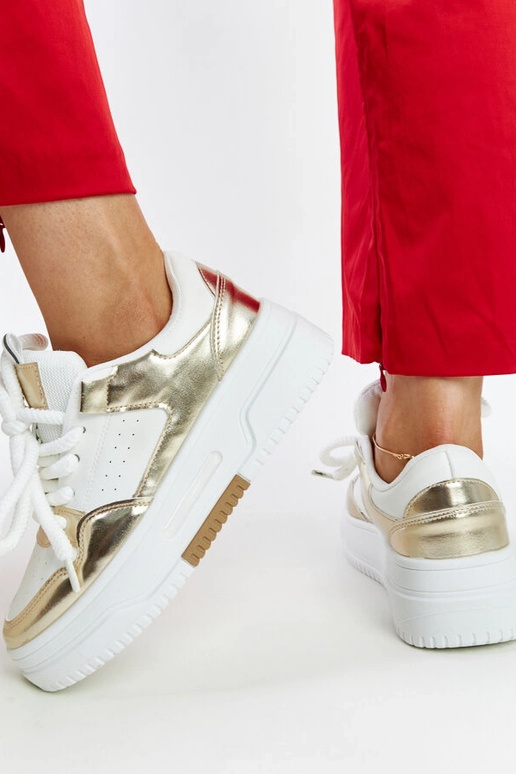 Biało-złote sneakersy na wysokiej...