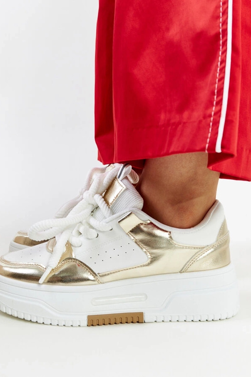Biało-złote sneakersy na wysokiej...