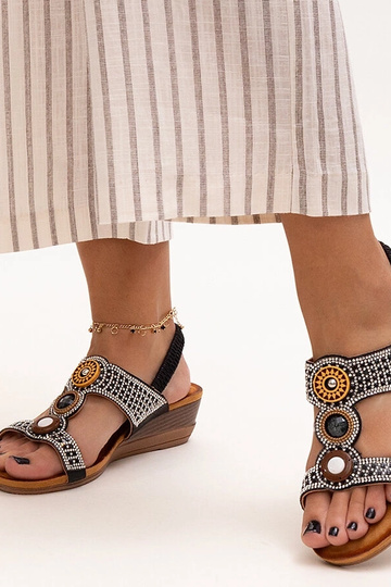 Black sandals on a block...