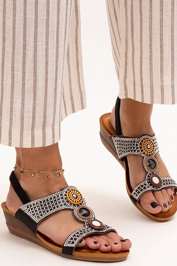 Black sandals on a block... 2