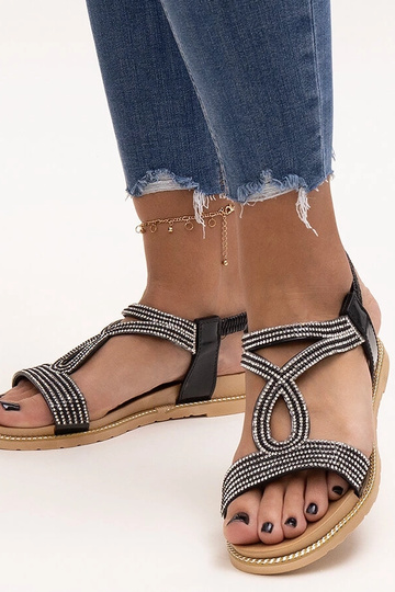 Black sandals on a block...