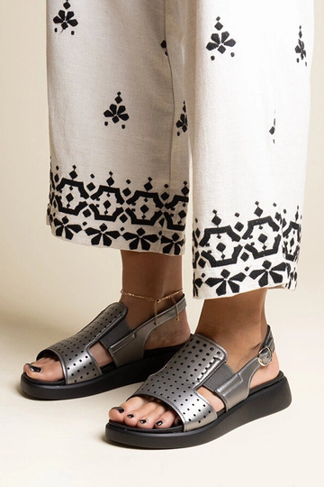 Black sandals on a block...