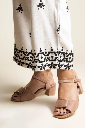 Black sandals on a block...