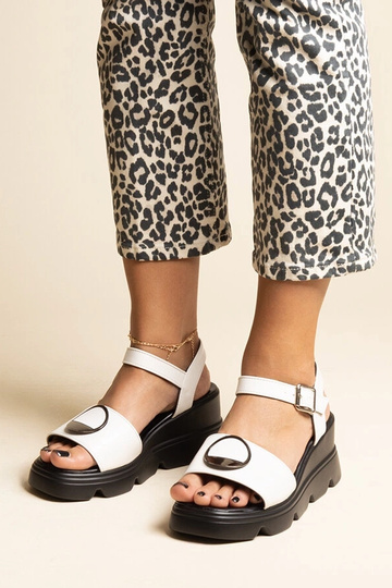 Black sandals on a block... 2