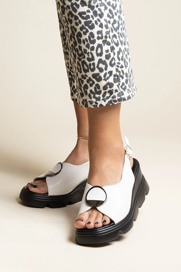 Black sandals on a block...