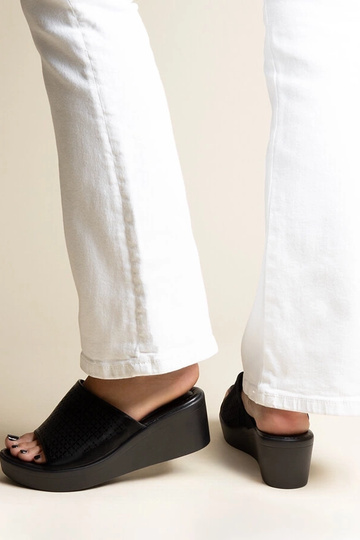 Black sandals on a block... 2