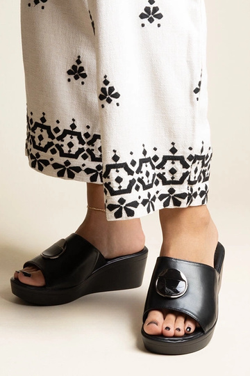 Black sandals on a block...