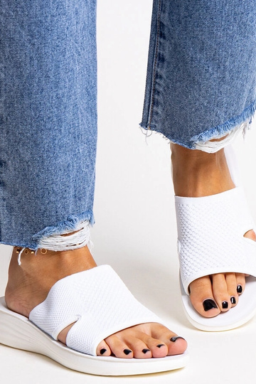 Black sandals on a block...