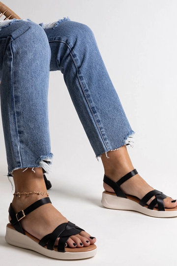 Black sandals on a block... 2