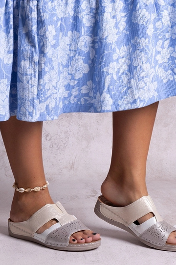 Black sandals on a block...