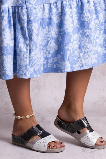 Black sandals on a block...
