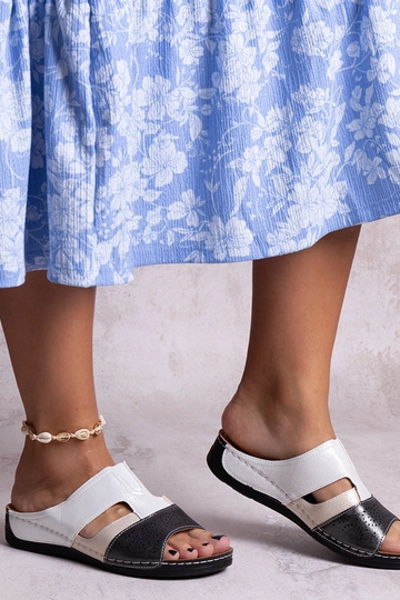 Black sandals on a block...
