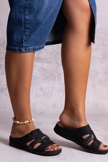 Black sandals on a block...