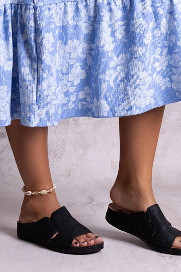 Black sandals on a block...