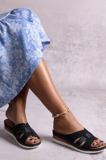 Black sandals on a block... 2