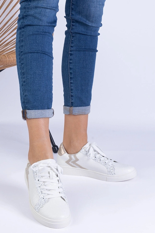 Białe sneakersy damskie z tłoczeniem... Białe sneakersy damskie z tłoczeniem...