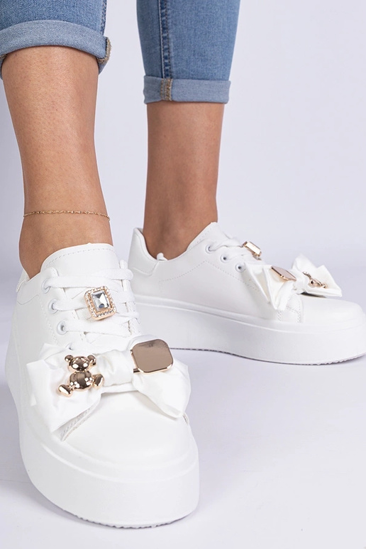 Białe sneakersy damskie zdobione...