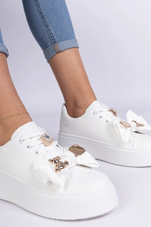 Białe sneakersy damskie zdobione...
