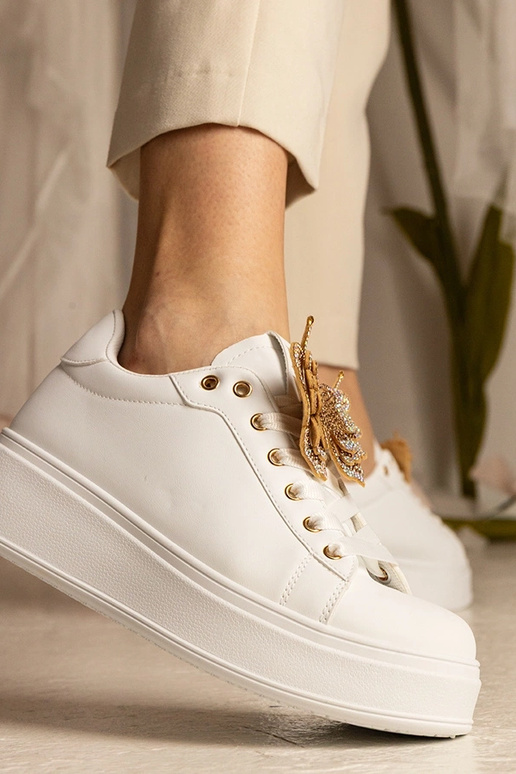 Białe sneakersy z motylkiem z... Białe sneakersy z motylkiem z...