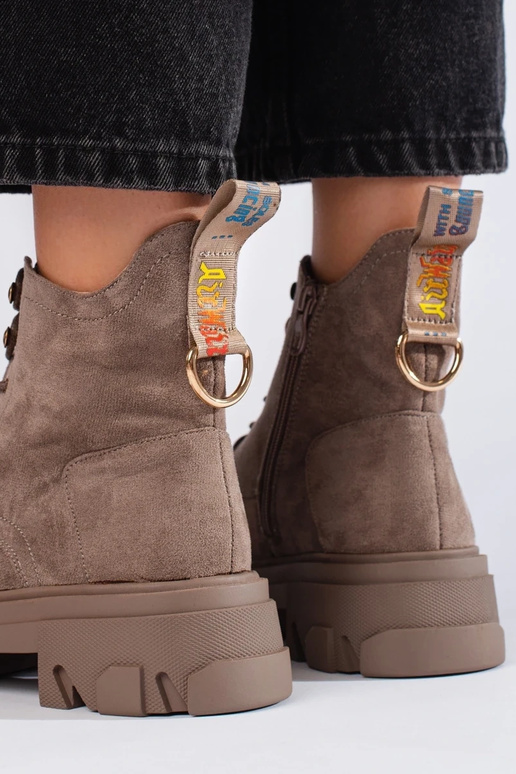 of suede Inomens boots on a thick sole