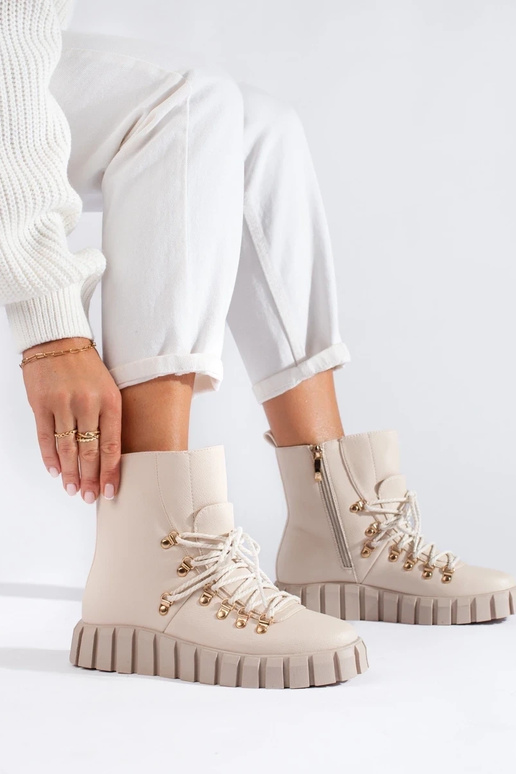 beige insulated Inomens boots Inith...