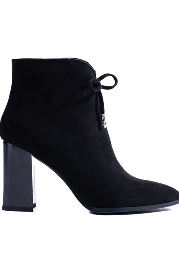 INomens boots on a high pole