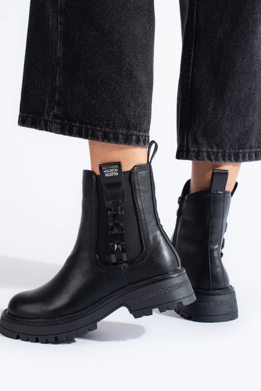 black INomens boots on a black sole black INomens boots on a black sole