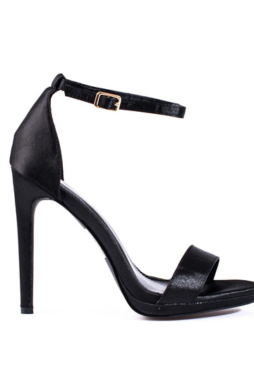 black sandals on a high...