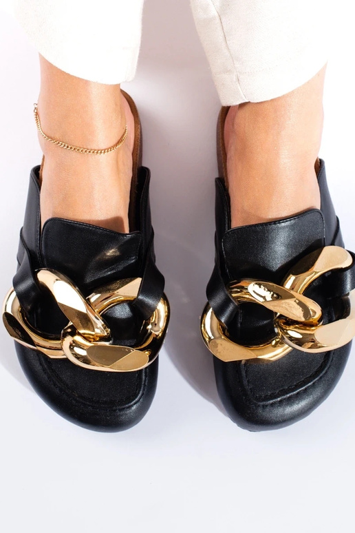 Black slippers with a massive... Black slippers with a massive...