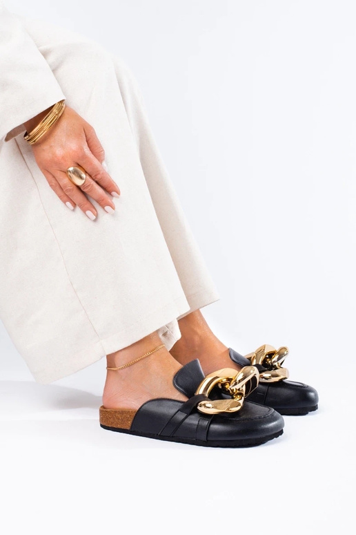 Black slippers with a massive... Black slippers with a massive...