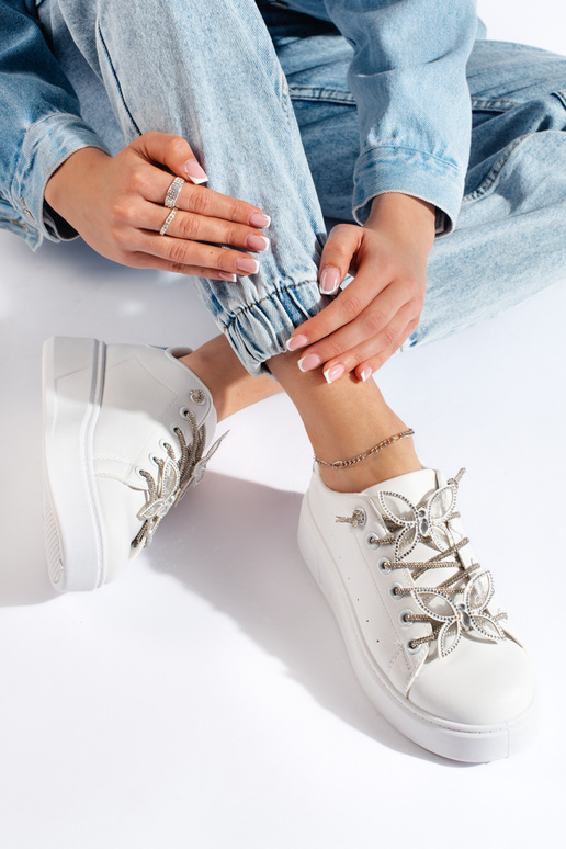 White sports shoes with butterflies White sports shoes with butterflies