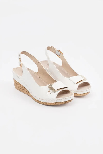 INhite color sandals on a... 2