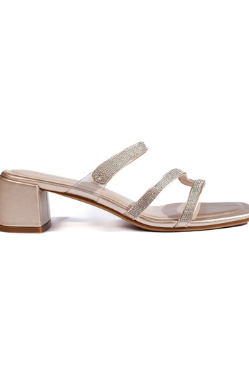 gold color sandals on the...