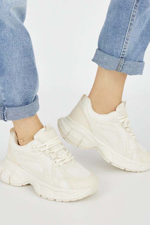 Sneakers model shoes beige on a thick...