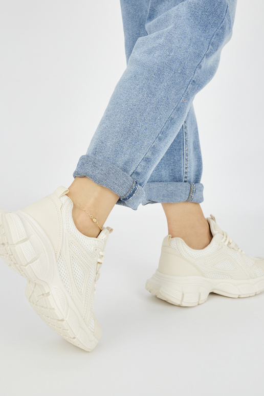 Sneakers model shoes beige on a thick...